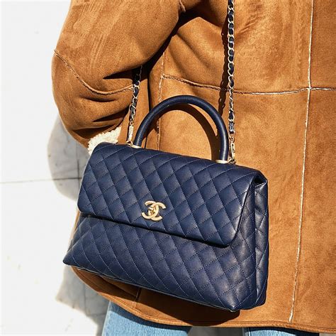 chanel flap bag with handle price|chanel flap bag top handle.